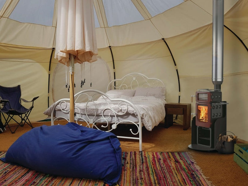 Load image into Gallery viewer, Ekol Baked Apple Pie Stack Wood Burning Ecodesign Stove installed in a yurt