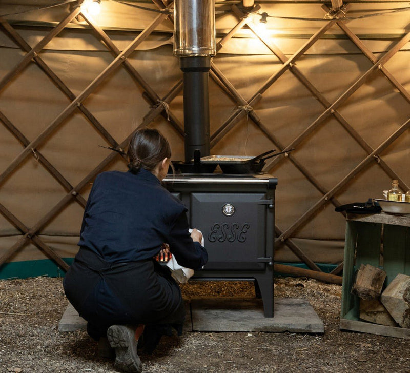 Load image into Gallery viewer, Esse Lightheart Wood Burning Ecodesign Range Cooker cleaning in a hut
